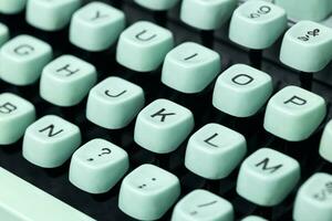 Close up of a vintage green typewriter keys. Selective focus photo