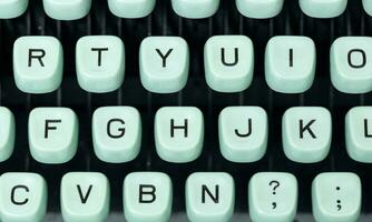 Top view of green retro typewriter keys photo