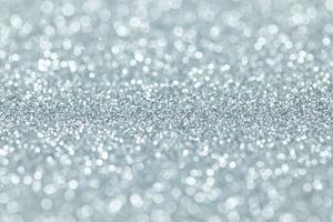 Silver glitter abstract background texture. Full frame. Selective focus photo