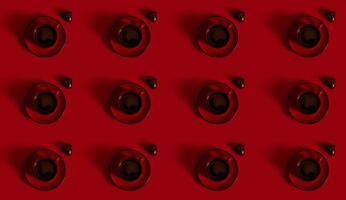 Pattern of Flat lay composition with a red cup of coffee on a ceramic saucer and a praline in the shape of heart on red background. Concept of chocolate day on red background with copy space photo