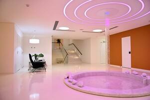 The interior of a modern luxury health spa. Spacious lounge zone in the spa clinic photo