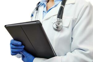 Closeup of doctor's hands in medical protective gloves holding tablet isolated on white background with copy space photo