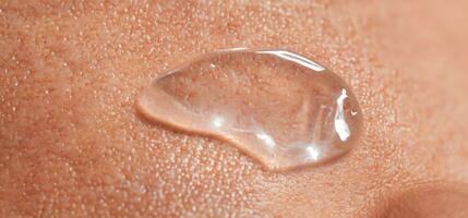 Collagen And Hyaluron Serum Gel On Skin. Splashing of Hyaluron gel. photo