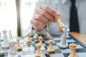 Businessman play with chess game. success management concept of business strategy and tactic challenge. photo