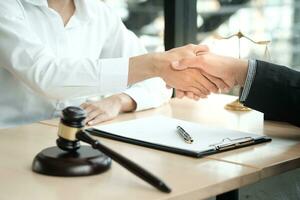 Lawyer handshake with client. Business partnership meeting successful concept. photo