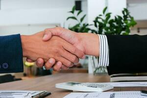 Businessman shaking hands successful making a deal. mans handshake. Business partnership meeting concept. photo