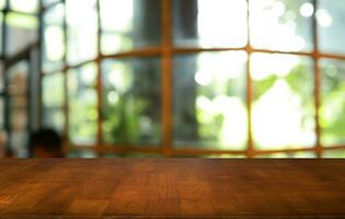 Wood table top in front of abstract blurred background. Empty wooden table space for text marketing promotion. blank wood table surface copy space photo