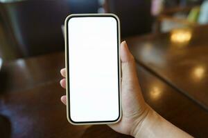 Close up of women's hands holding cell telephone blank copy space screen. smart phone with technology concept photo