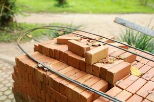 Pallet a red brick building material stack of new red bricks for construction. photo