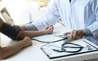 Doctor check body by stethoscope. Healthcare and medical concept. Professional medical doctor in white uniform gown coat interview consulting patient. photo