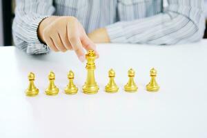 Human resources concept career management with clasped hands planning strategy with chess figures. photo