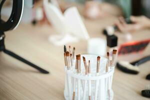 Decorative cosmetics makeup set on wood table. Set of luxury makeup product background photo