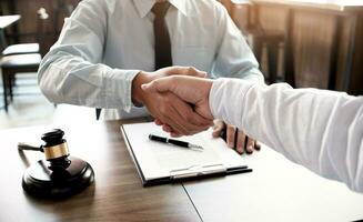 lawyer handshake with client. Business partnership meeting successful concept. photo