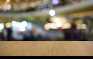 Empty wooden table in front of abstract blurred background of coffee shop . can be used for display or montage your products.Mock up for display of product photo