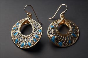 Beautiful earrings on dark background, closeup. Luxury jewelry. photo