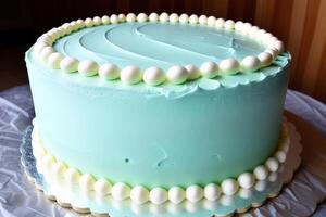 Birthday cake with white chocolate and green buttercream frosting. photo
