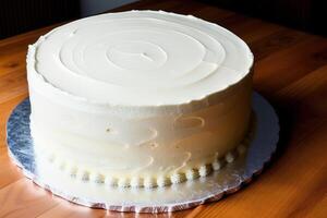 Close up of a white chocolate cake on a wooden table in a restaurant. photo