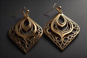 Gold earrings on a black background. Luxury jewelry. photo