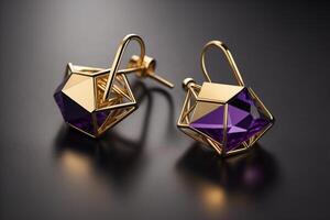 Pair of gold earrings with purple gemstone on black background. photo