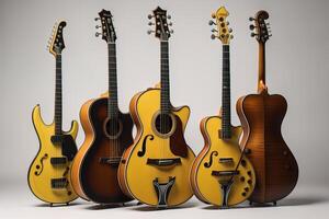 Set of six acoustic guitars on a gray background. photo