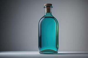 Bottle with a blue liquid on a gray background. photo