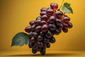 Bunch of ripe grapes on a yellow background. photo