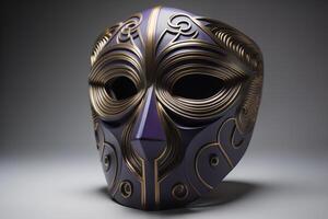 a black mask with gold pattern on a gray background. photo