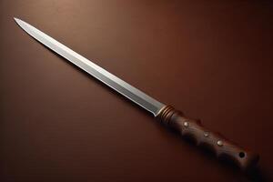 hunting knife with wooden handle on a brown background, close-up. photo