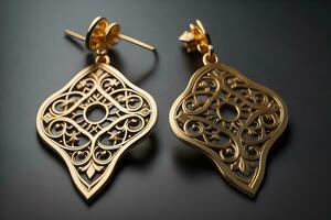 Earrings made of gold on a solid color background close up. ai generative photo