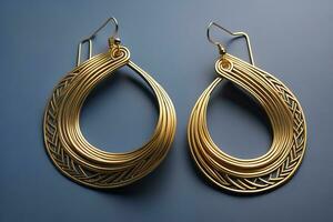 Earrings made of gold on a solid color background close up. ai generative photo