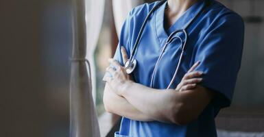 Homecare nursing service and elderly people cardiology healthcare. Close up of young hispanic female doctor nurse check mature caucasian man patient heartbeat using stethoscope during visit photo