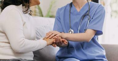 Homecare nursing service and elderly people cardiology healthcare. Close up of young hispanic female doctor nurse check mature caucasian man patient heartbeat using stethoscope during visit photo