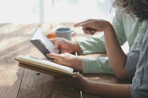 Embraced mature couple surfing the Internet on laptop at home photo