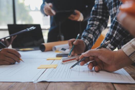 Construction and structure concept of Engineer or architect meeting for project working with partner and engineering tools on model building and blueprint in working site, contract for both companies. photo