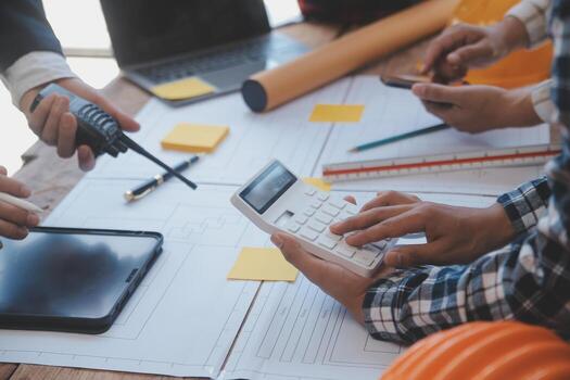 Construction and structure concept of Engineer or architect meeting for project working with partner and engineering tools on model building and blueprint in working site, contract for both companies. photo