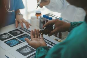 Cropped image of successful medical doctors discussing diagnosis during the conference photo