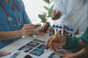 Cropped image of successful medical doctors discussing diagnosis during the conference photo