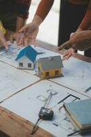 Two business man construction site engineer. Engineering objects on workplace with partners interacting on background photo
