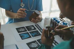Medical technology network team meeting concept. Doctor hand working smart phone modern digital tablet laptop computer graphics chart interface, sun beams effect photo
