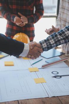 Engineer Teamwork Meeting, Drawing working on blueprint meeting for project working with partner on model building and engineering tools in working site, Construction and structure concept. photo