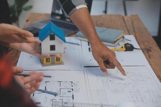 Engineer Teamwork Meeting, Drawing working on blueprint meeting for project working with partner on model building and engineering tools in working site, Construction and structure concept. photo