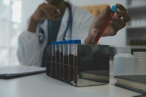 Professional lab. Amazing longhaired medical worker wearing uniform while using microscope during research photo