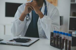 Professional lab. Amazing longhaired medical worker wearing uniform while using microscope during research photo