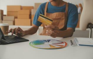 Retail, credit card payment service. Customer paying for order of cheese in grocery shop. photo