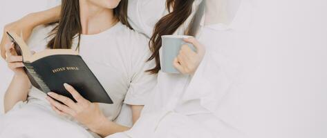 happy teenage girls friend using mobile phone for online shopping in bedroom photo