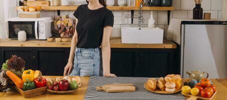 Laughing group of diverse young woman hanging out at home together and eating pizza photo