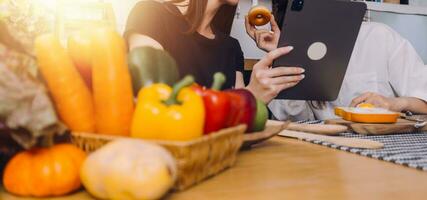 Laughing group of diverse young woman hanging out at home together and eating pizza photo