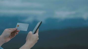 online payment, young woman holding credit card and typing on laptop video