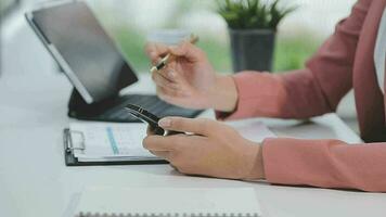 Financial analysts analyze business financial reports on a digital tablet planning investment project during a discussion at a meeting of corporate showing the results of their successful teamwork. video