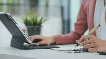 Financial analysts analyze business financial reports on a digital tablet planning investment project during a discussion at a meeting of corporate showing the results of their successful teamwork. video